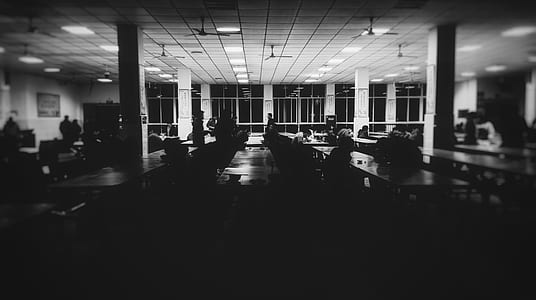 grayscale photo of people in room thumbnail
