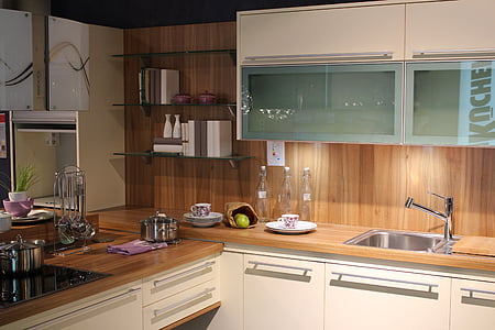 kitchenwares on top of wooden cabinet thumbnail