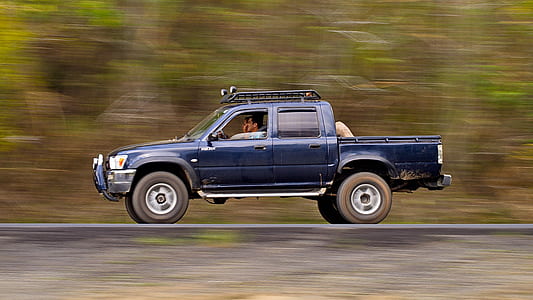 blue crew-cab on road thumbnail
