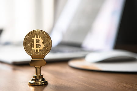 Bitcoin on brown table thumbnail