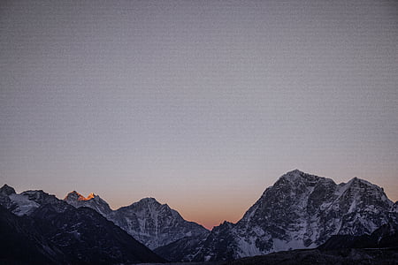 landscape photo of mountain covered with snow at golden hour thumbnail