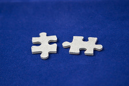 two white jigsaw puzzle pieces thumbnail
