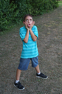 boy wearing green and white striped polo shirt thumbnail