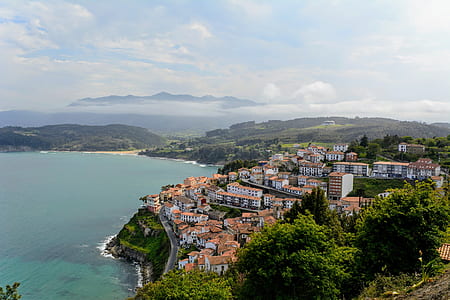 city near the ocean during day thumbnail
