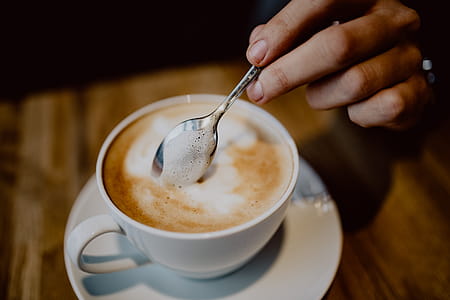 Cup of coffee on table in cafe thumbnail