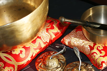 black and silver mortar and pestle on red and gold floral pillow thumbnail