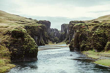 Stream Water Passing Through Cliffs Photo thumbnail