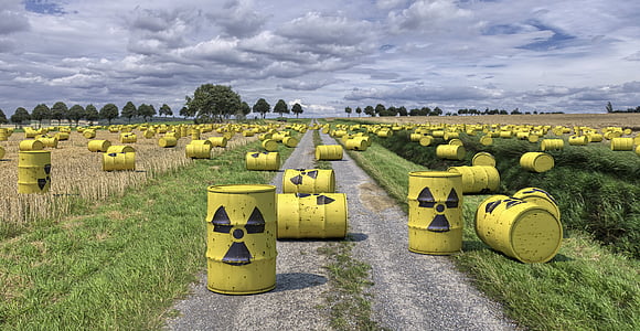 yellow metal tank containers on green grass field thumbnail