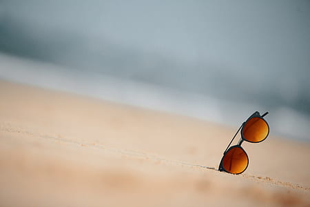 sunglasses on sand thumbnail