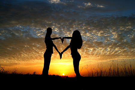 silhouette photo of a man and woman on sunset thumbnail