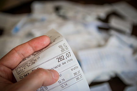closeup photography of white receipt paper thumbnail