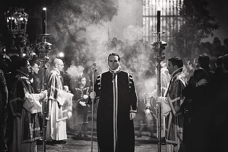 Grayscale Photography Of Priests thumbnail