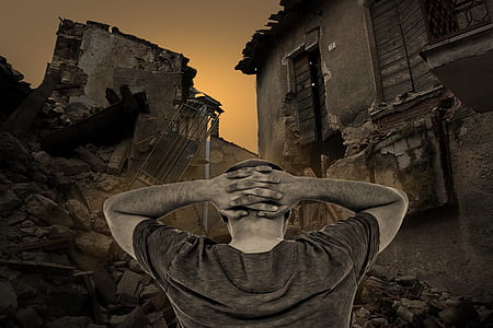 man wearing gray shirt standing near house digital wallpaper thumbnail
