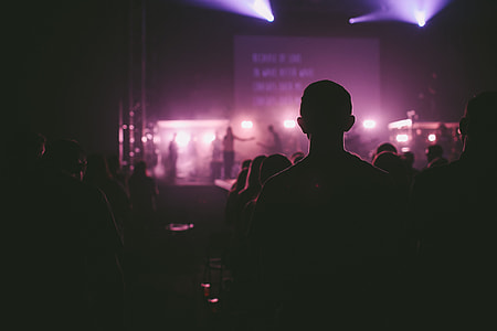 silhouette of people watching band on stage thumbnail