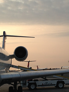 photo of white airliner on plane station thumbnail