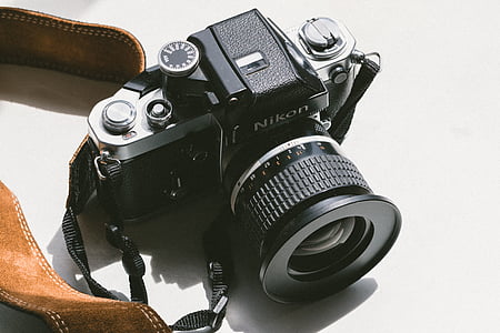 black Nikon SLR camera thumbnail