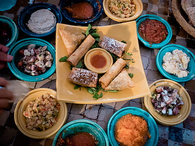 assorted dishes on yellow and blue ceramic bowls thumbnail