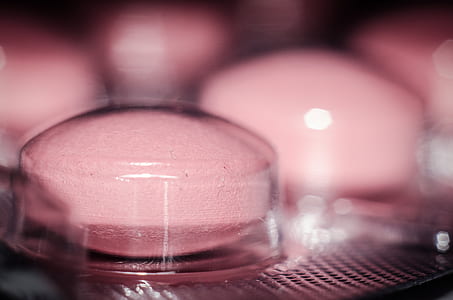 closeup photography of pink medication pill thumbnail