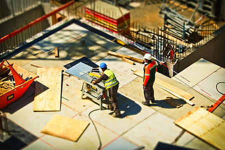 two men working in construction during daytime thumbnail