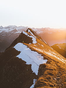 snow covered mountain during daytime thumbnail