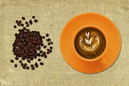brown coffee beans near orange mug thumbnail