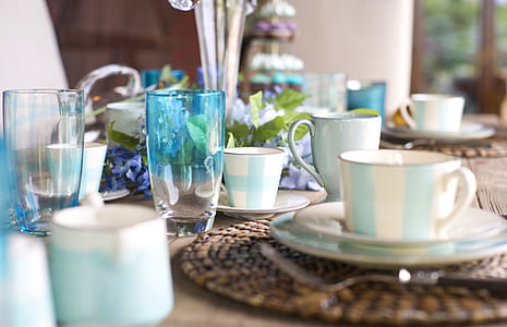 cups and glasses on table with vase thumbnail