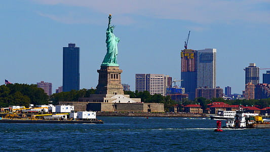 Statue of Liberty in busy New York Harbor. thumbnail