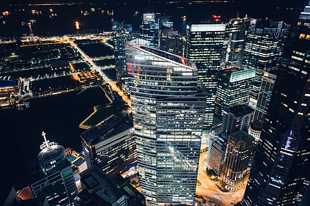 aerial photography of city high-rise buildings at nighttime thumbnail