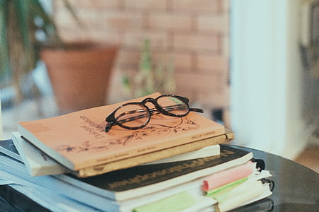 black eyeglasses on book thumbnail