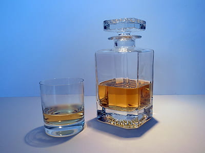 clear glass decanter and rocks glass filled with whisky thumbnail