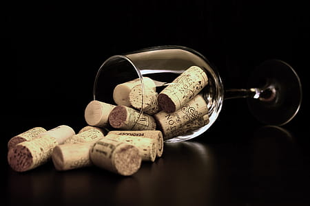 Brown Corks on Clear Wine Glass thumbnail