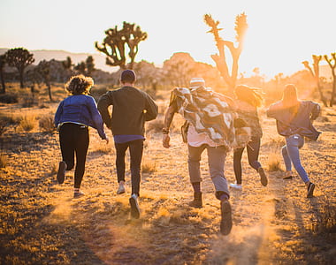 group of people running on desert thumbnail