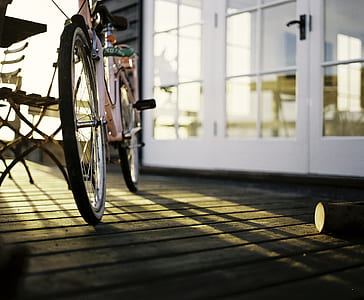 beige bicycle beside bench thumbnail