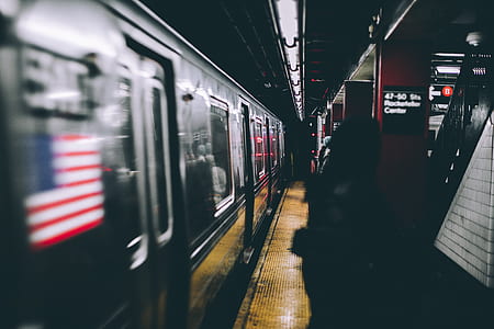 silver train at train station thumbnail
