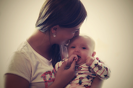 woman carrying baby thumbnail