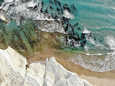aerial photo of sea shore during daytime thumbnail