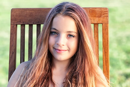 portrait photography of girl with brown hair during daytime thumbnail