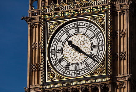 brown concrete tower clock displaying 10:21 at daytime thumbnail