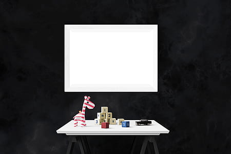 rectangular white table near black wall thumbnail