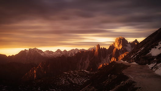 aerial photo of snow covered mountain during sun rise thumbnail