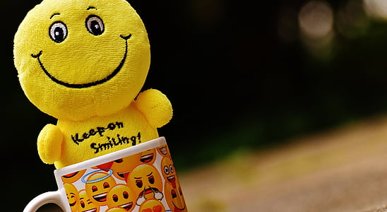multicolored emoji-themed ceramic mug with emoji plush toy thumbnail