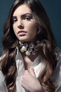 woman wearing white button-up dress shirt with white pearl choker necklace thumbnail