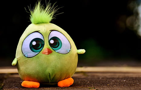 bird cartoon character plush toy on brown surface thumbnail