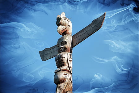 brown wooden totem with blue background thumbnail