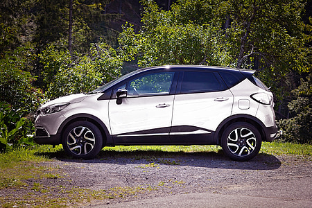 grey SUV parked near green leafed trees during daytime thumbnail