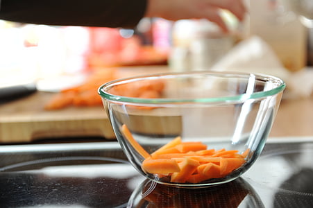 sliced carrots in clear glass bowl thumbnail