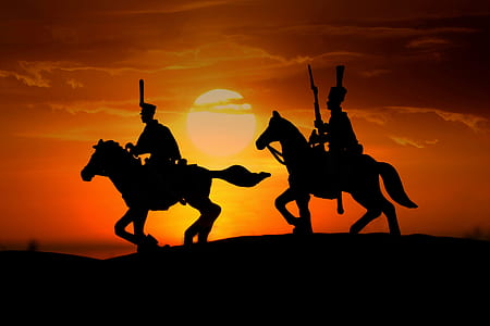 silhouette of person riding on horses thumbnail