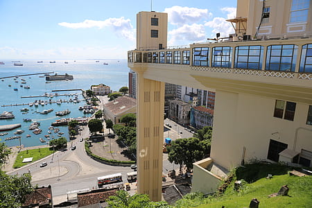 aerial photography of building near sea at daytime thumbnail