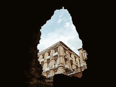 view of building inside cave thumbnail