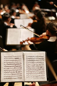 song note on stand near orchestra thumbnail